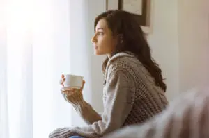 women thinking about self isolation at home